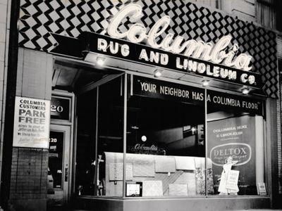 Columbia Rug Carpet One flooring store old storefront sign and window